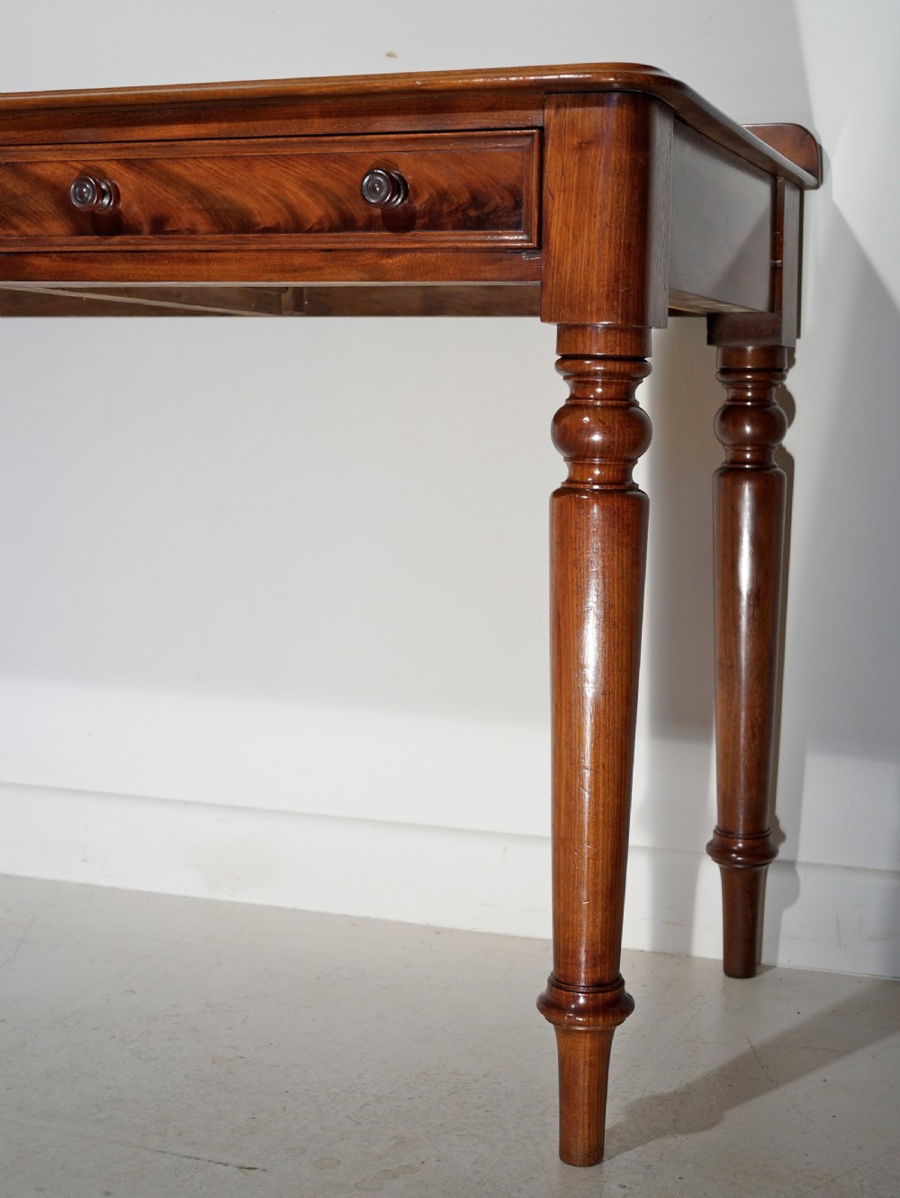Victorian 1860s mahogany table with two drawers supported on four turned tapering legs. View VI
