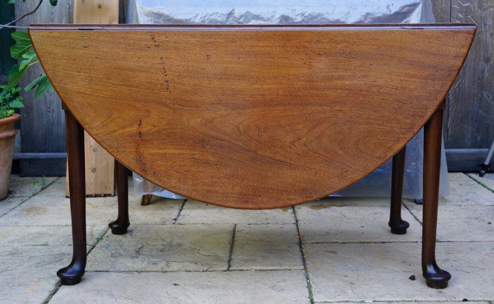                                                      Mahogany oval pad foot dining table Circa 1800 with bold pad foot View II