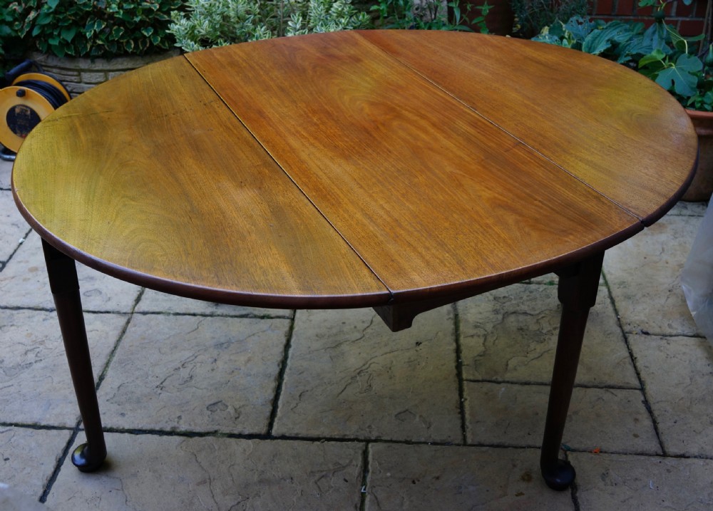                                                      Mahogany oval pad foot dining table Circa 1800 with bold pad foot View V