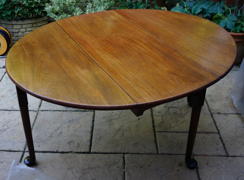                                                      Mahogany oval pad foot dining table Circa 1800 with bold pad foot