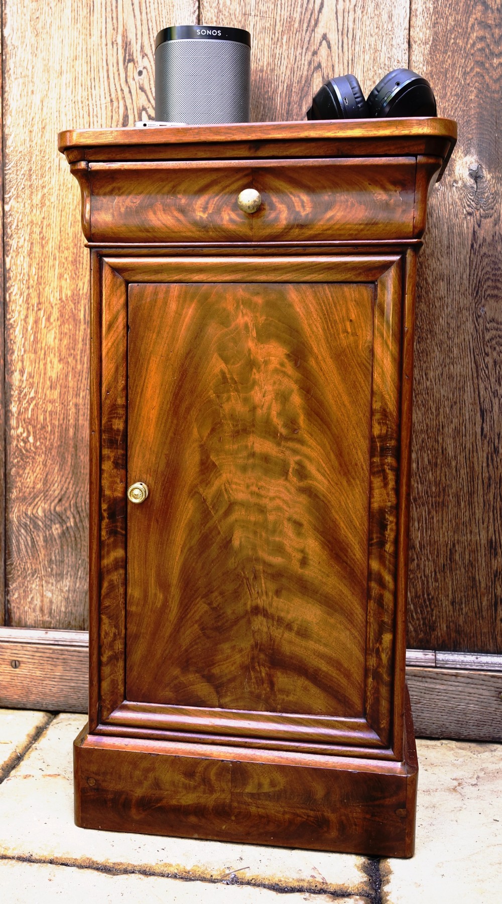 Beautifully figured mahogany continental side cupboard with drawer