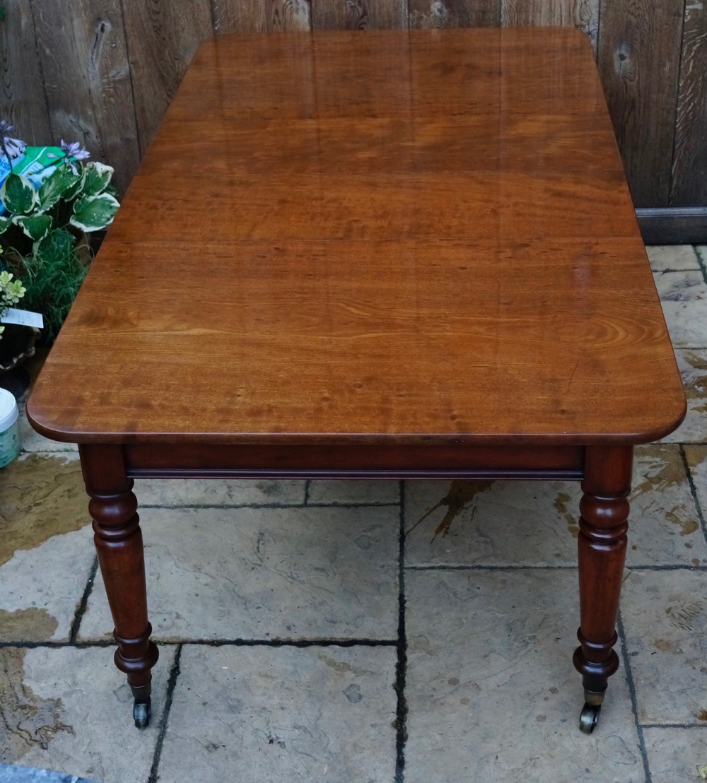 Solid Mahogany extending dining table.
