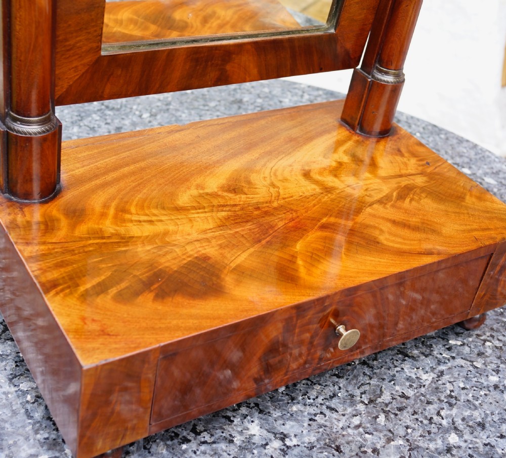 A Victorian mahogany swing dressing mirror featuring a pediment top decorated with a brass mount, side columns, and a single drawer base. View III