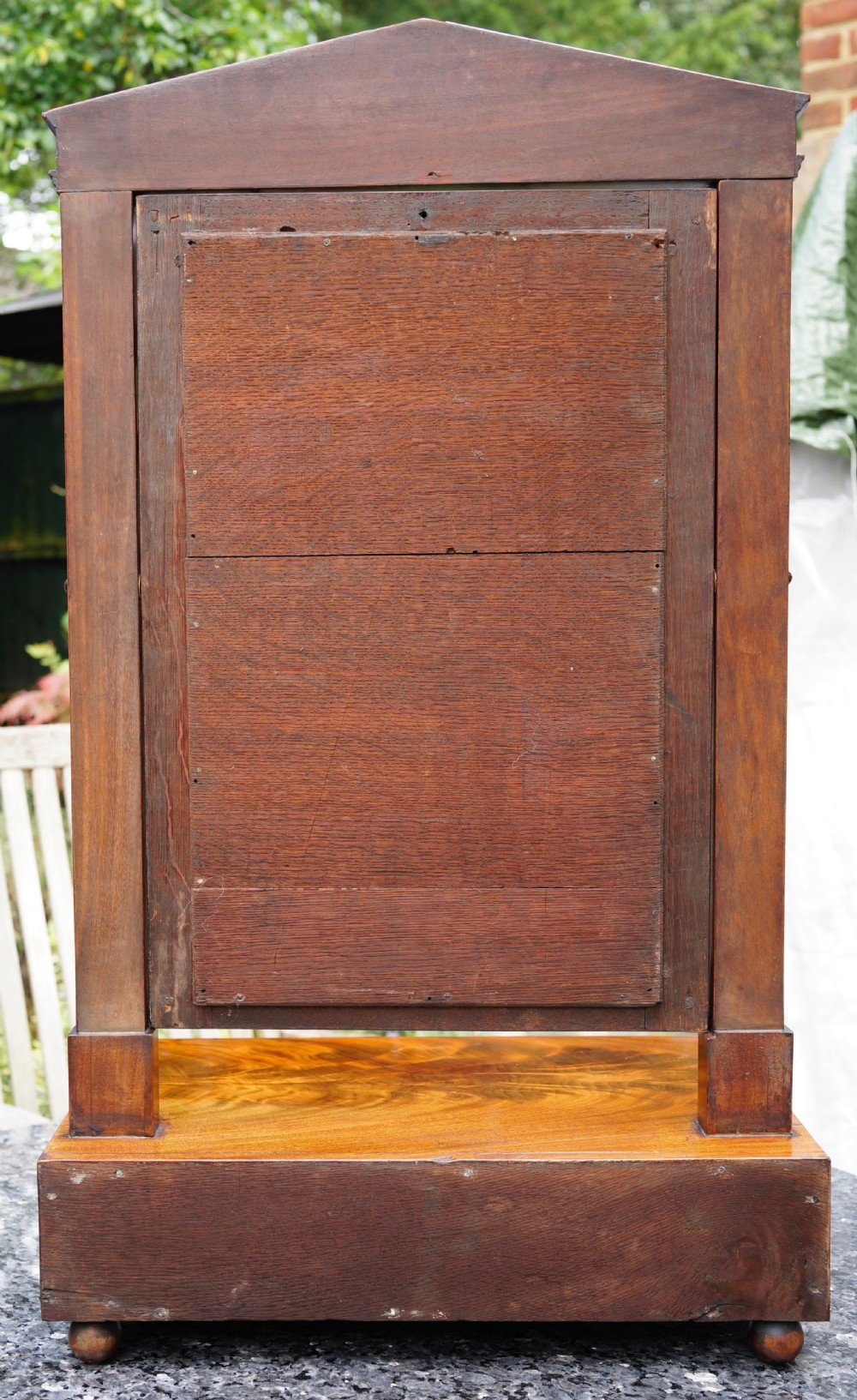A Victorian mahogany swing dressing mirror featuring a pediment top decorated with a brass mount, side columns, and a single drawer base. View IV