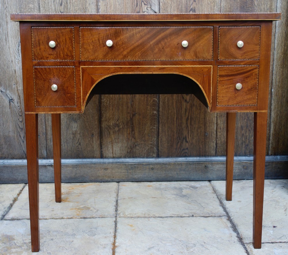 Late Georgian small compact five drawer mahogany and inlaid kneehole side table  View II
