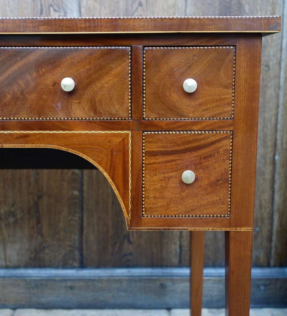 Late Georgian small compact five drawer mahogany and inlaid kneehole side table  View III