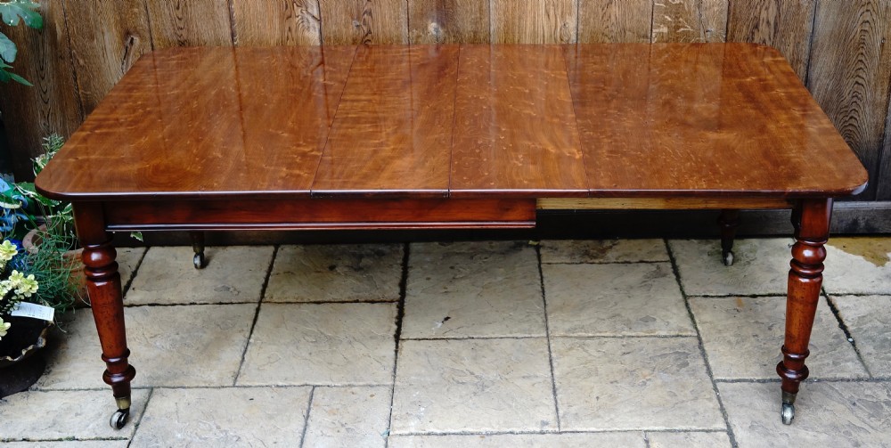 Solid Mahogany extending dining table. View IX