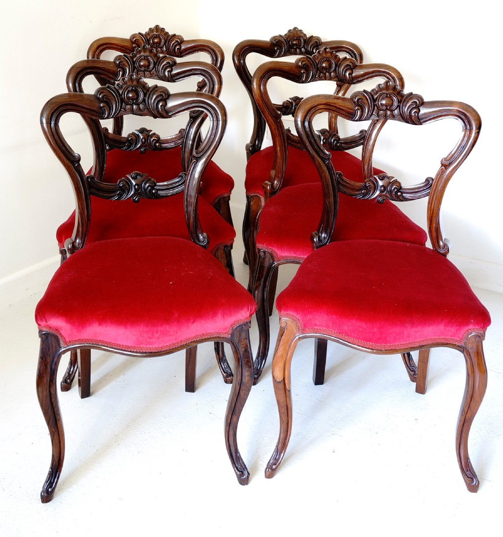 Set of six Victorian solid rosewood dining chairs with finely carved detail supported View II