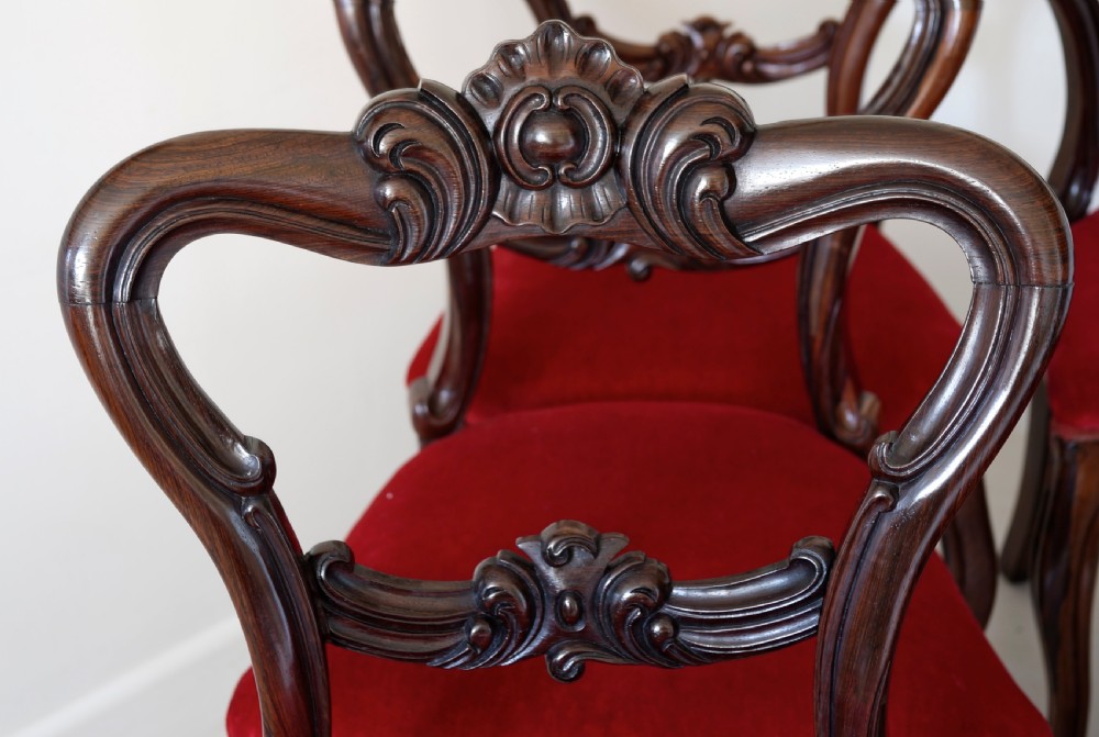 Set of six Victorian solid rosewood dining chairs with finely carved detail supported View III