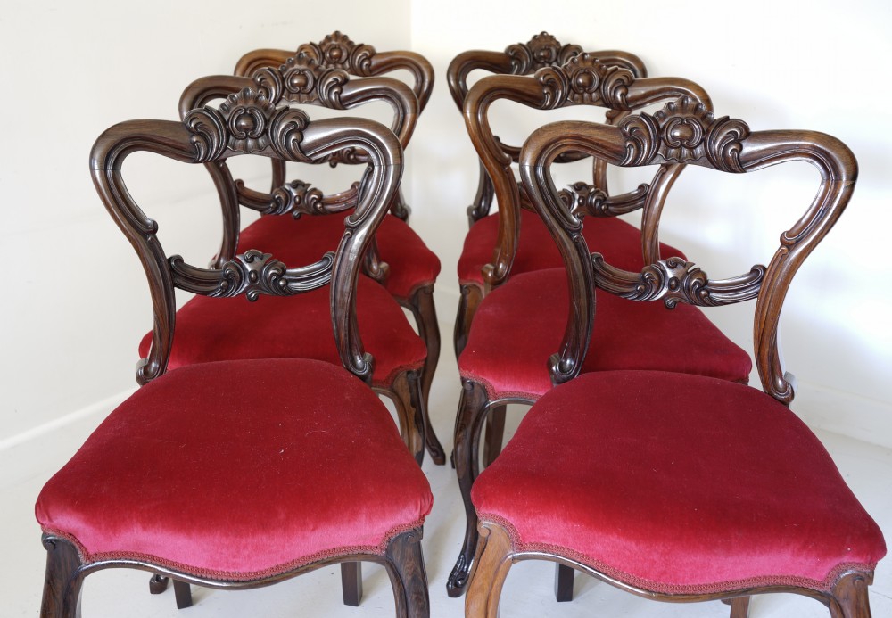 Set of six Victorian solid rosewood dining chairs with finely carved detail supported View VI