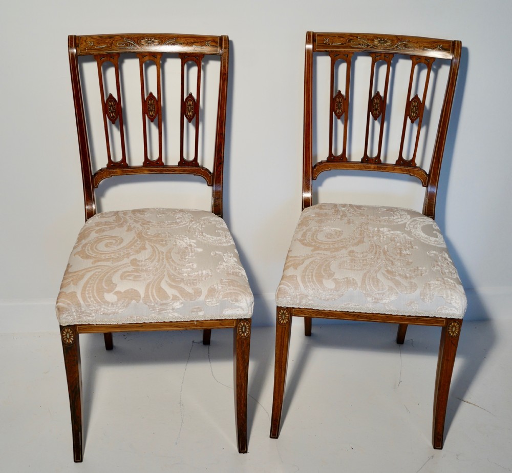 A superb Edwardian pair of solid inlaid rosewood chairs