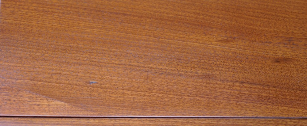 An eighteenth-century mahogany drop leaf table with a polished rectangular top, turned legs, and hand-carved claw and ball feet. View V