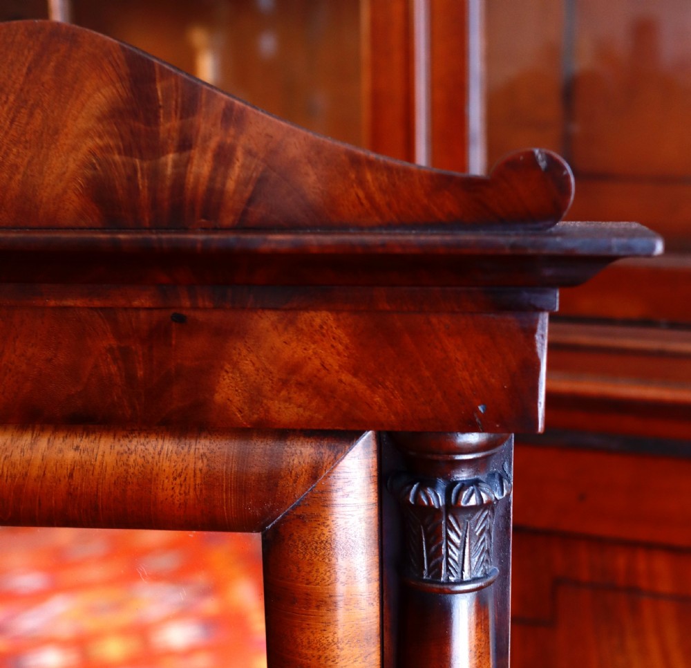 An antique mahogany tabletop toilet mirror featuring an adjustable swivel glass frame supported by turned columns over a two-drawer serpentine base. View III