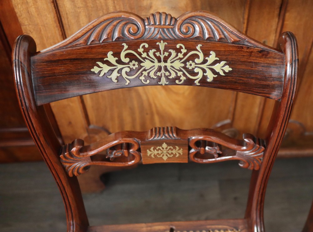Pair of regency rosewood brass inlaid sabre leg chairs  View II