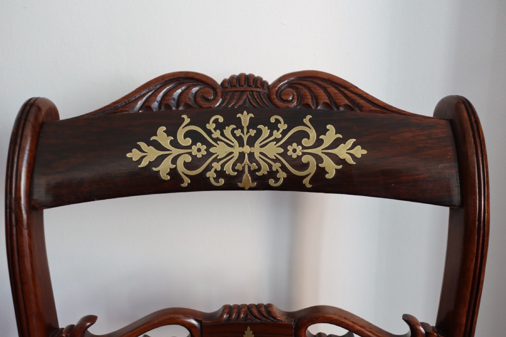 Pair of regency rosewood brass inlaid sabre leg chairs  View V