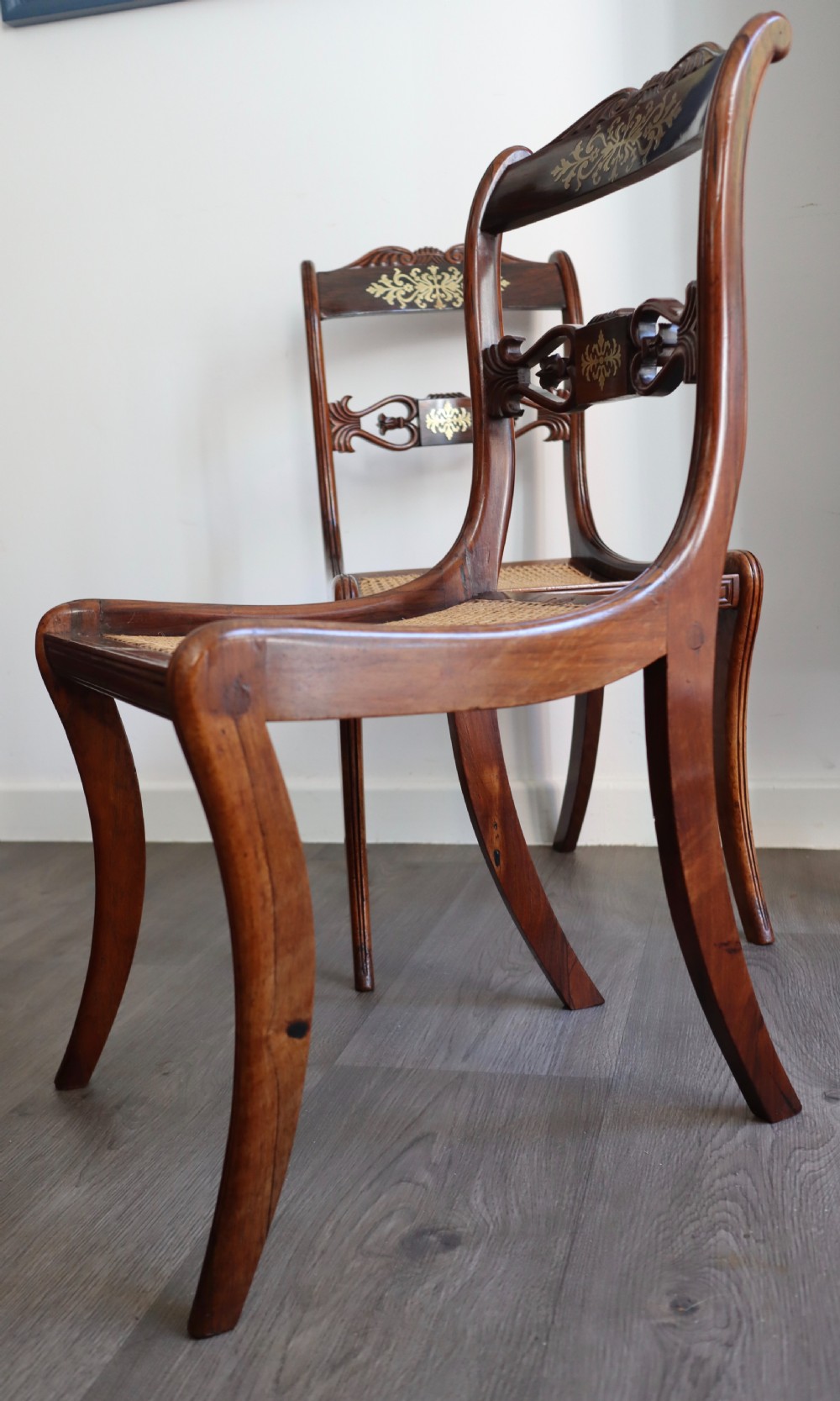 Pair of regency rosewood brass inlaid sabre leg chairs  View VII