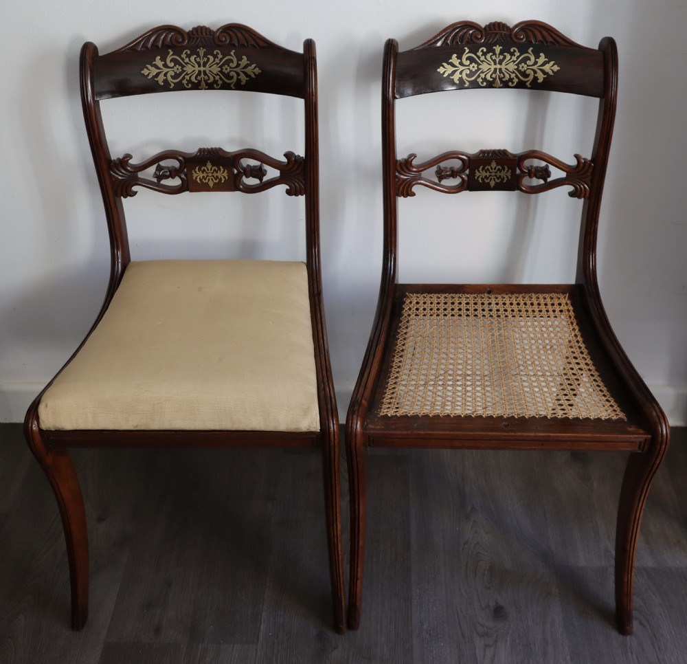 Pair of regency rosewood brass inlaid sabre leg chairs 