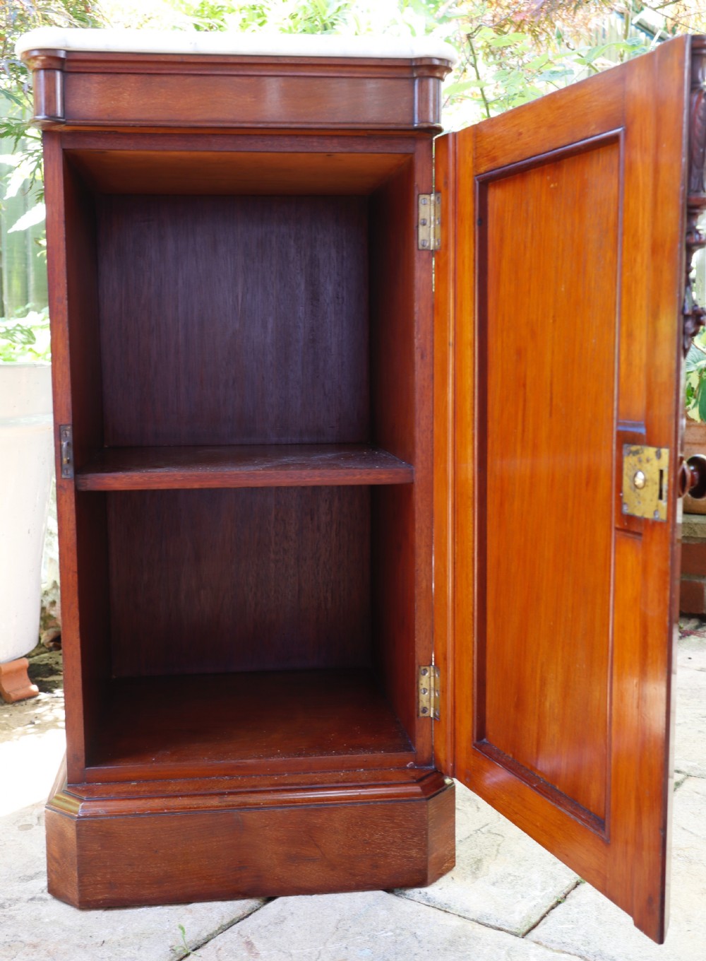 Antique mahogany single door cupboard.