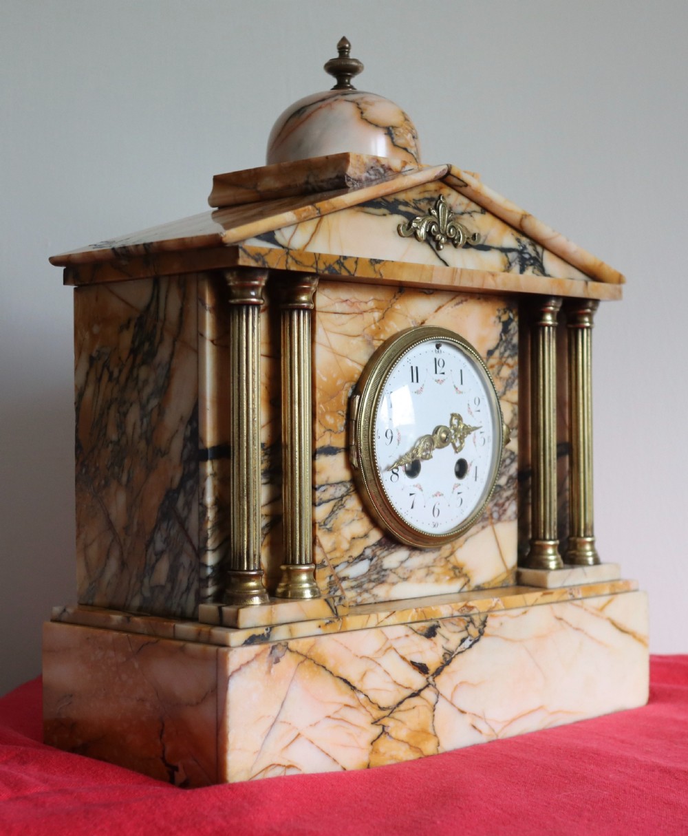 Antique French marble mantel clock with brass column's Circa 1890s