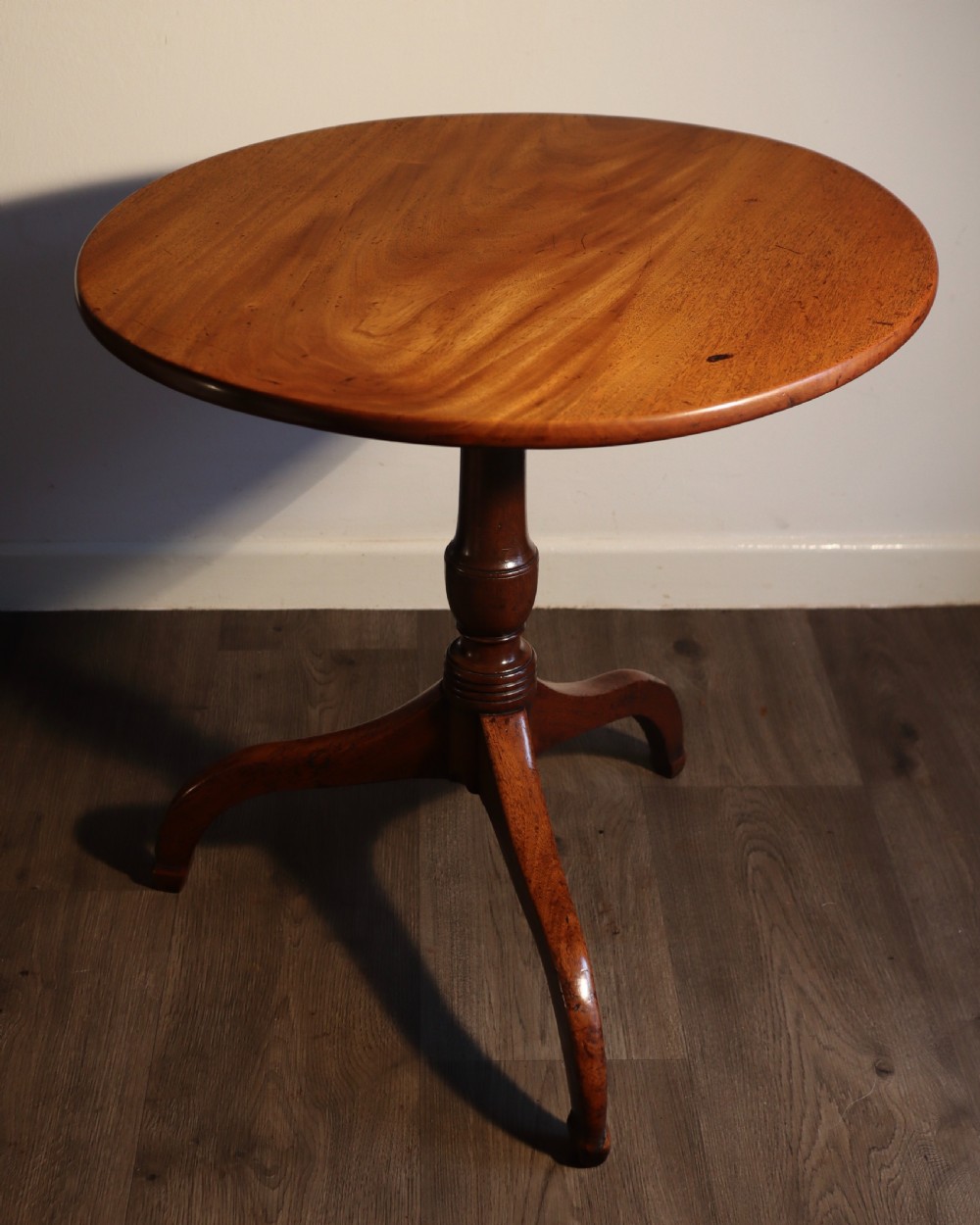 Antique mahogany tripod table.