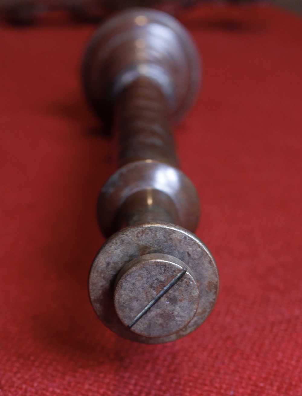 A patinated bronze processional crucifix featuring trefoil terminals, a cast figure of Christ, and a barley twist lower shaft. View VIII