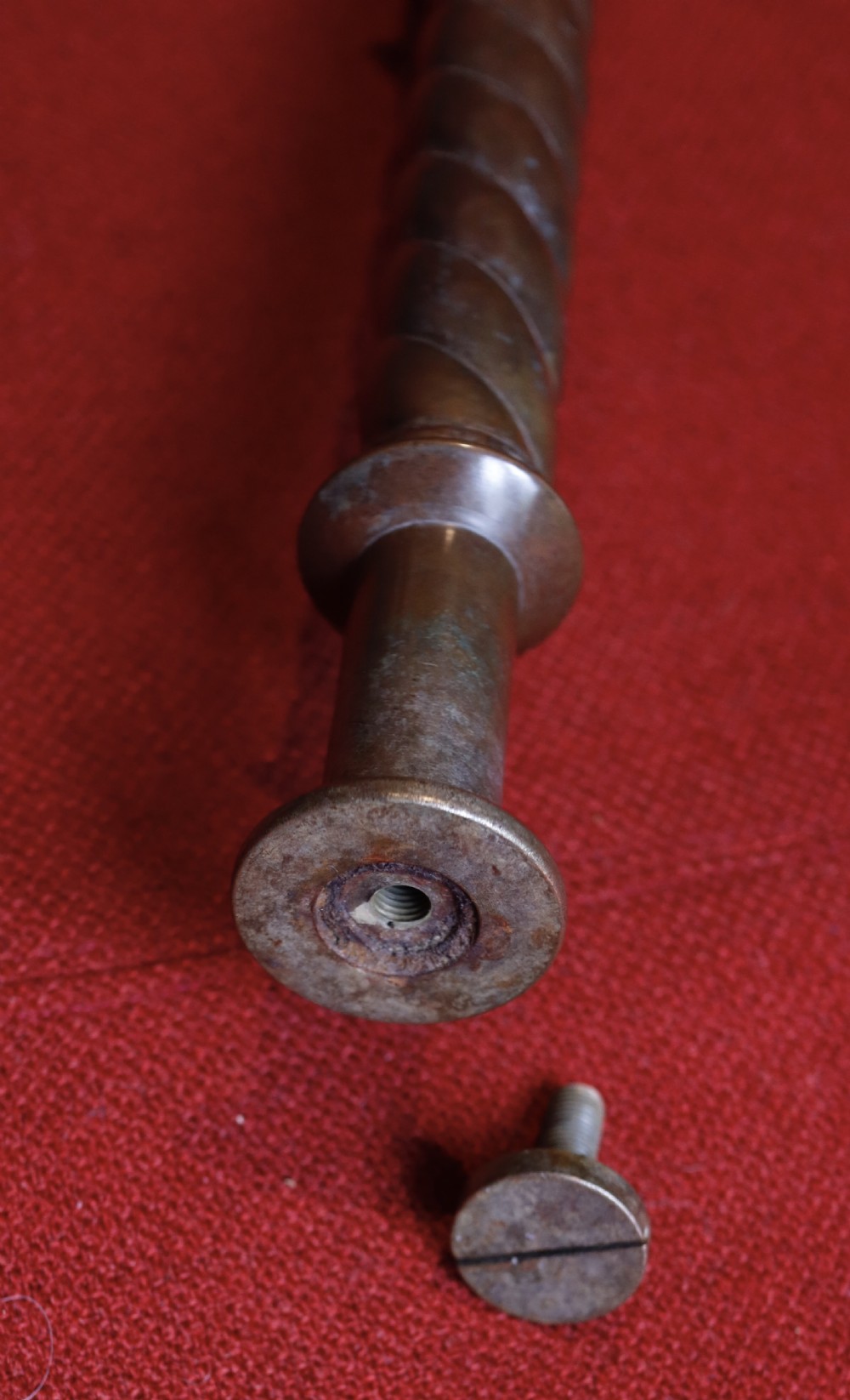 A patinated bronze processional crucifix featuring trefoil terminals, a cast figure of Christ, and a barley twist lower shaft. View IX
