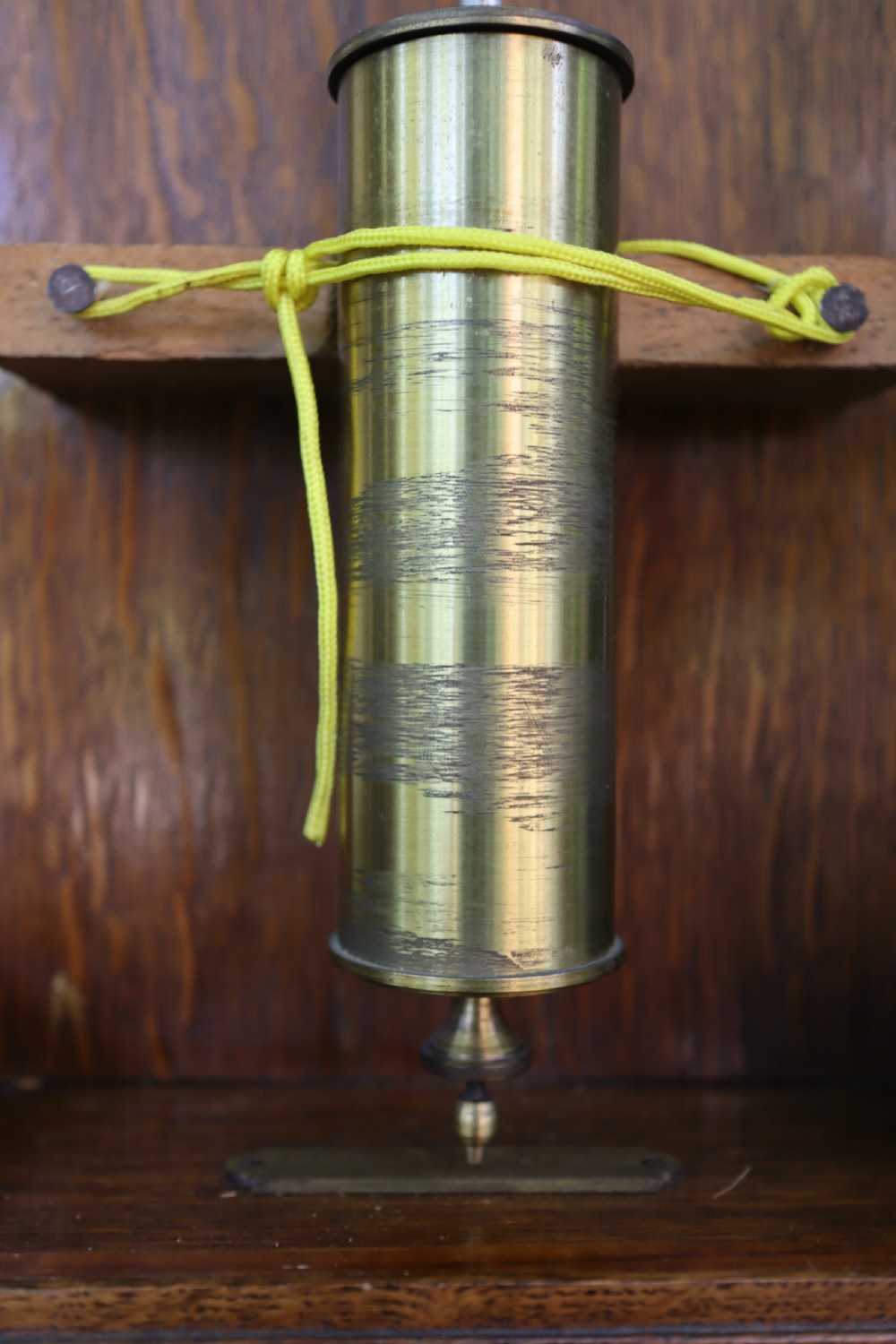 An antique oak longcase clock featuring a circular brass dial with Roman numerals and a full-length glazed trunk door revealing the pendulum and movement. View X