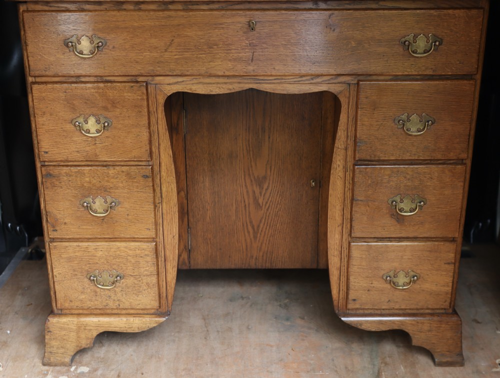 Oak kneehole desk.