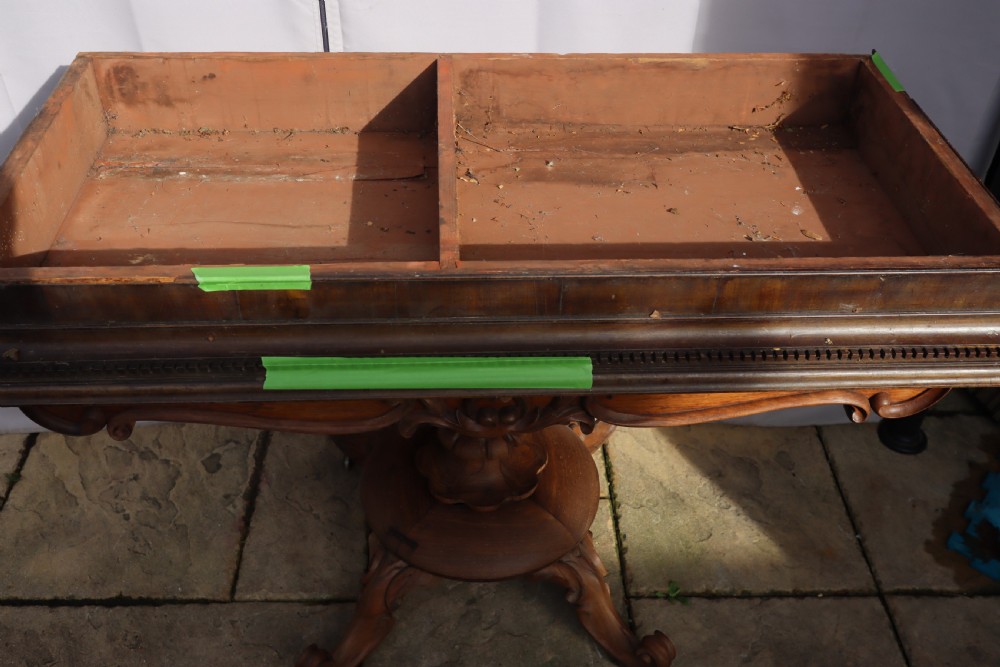 An antique Georgian mahogany cabinet cornice featuring carved dentil moulding and internal timber partition sections. View II