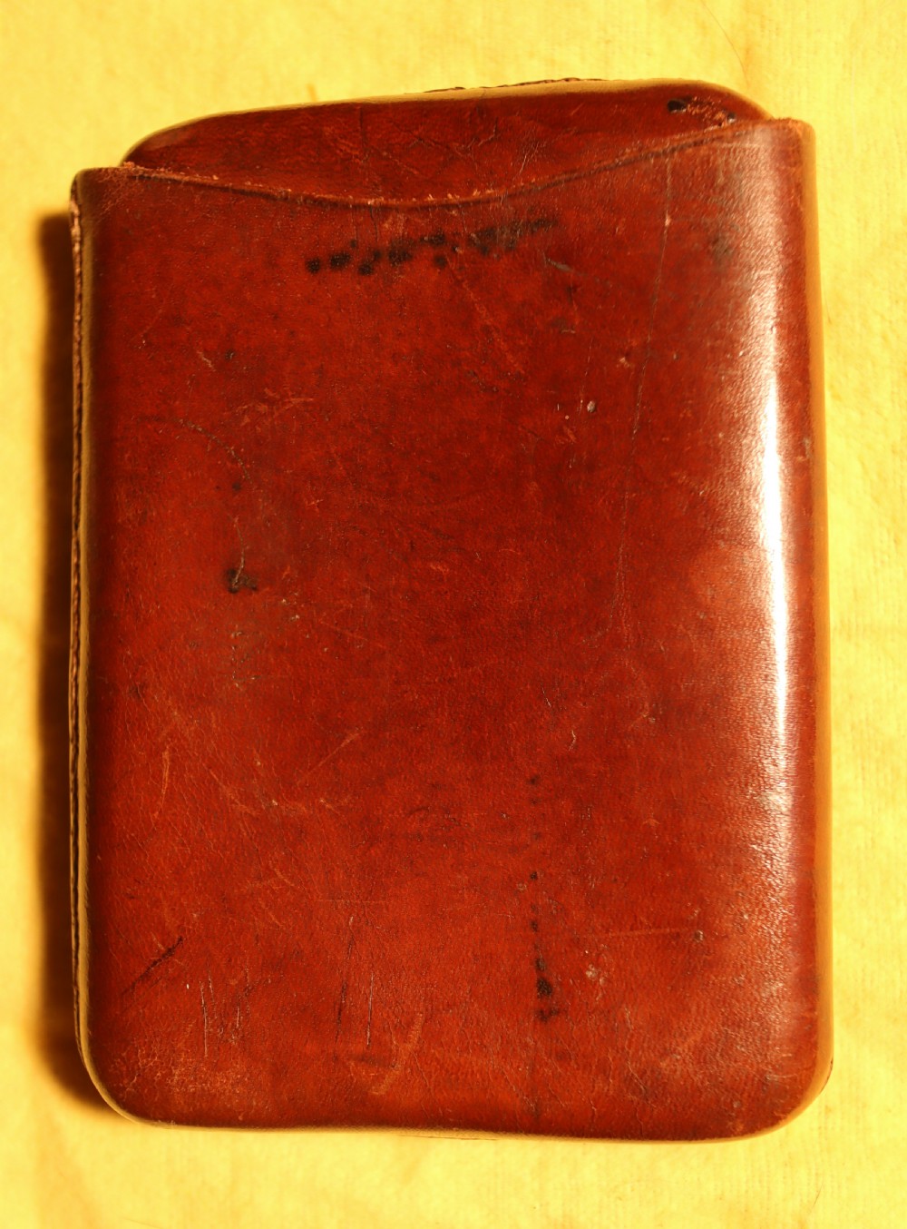 A two-piece chestnut brown saddlers leather cigar case featuring an oval embossed stamp reading Real Saddlers English Make Leather. View III