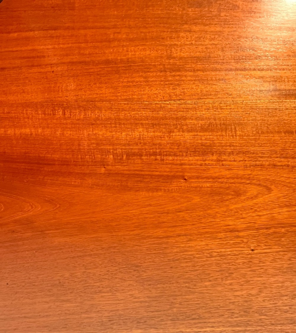 A circular mahogany antique extending dining table featuring carved cabriole legs with ball and claw feet and a rope-carved rim edge. View VIII