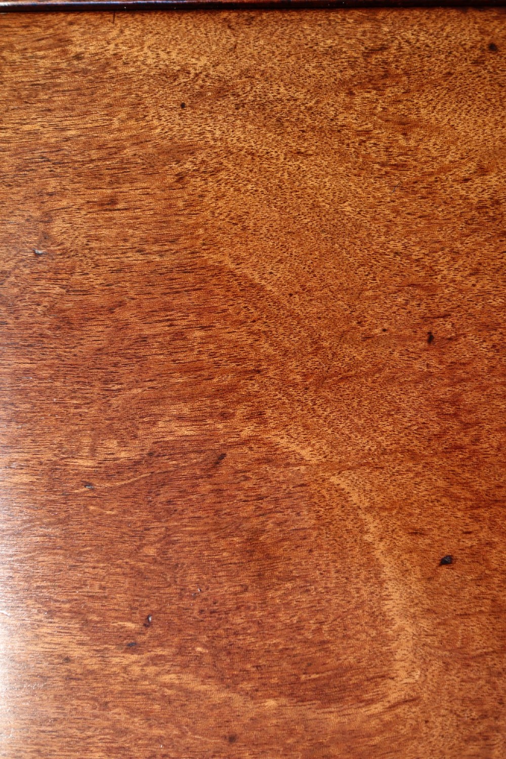 A Georgian mahogany spider leg tea table featuring two hinged drop leaves and slender turned gateleg supports connected by stretchers. View VI