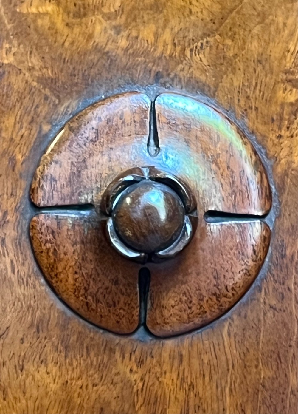 A Victorian warm brown timber pot cupboard featuring a single fielded panel door with a carved central wooden knob and a sturdy plinth base. View IV
