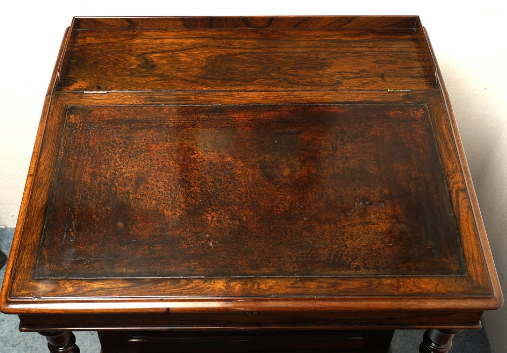 A Victorian rosewood Davenport desk featuring barley twist front supports, side drawers with wooden knob handles, and a hinged slanted top. View VII
