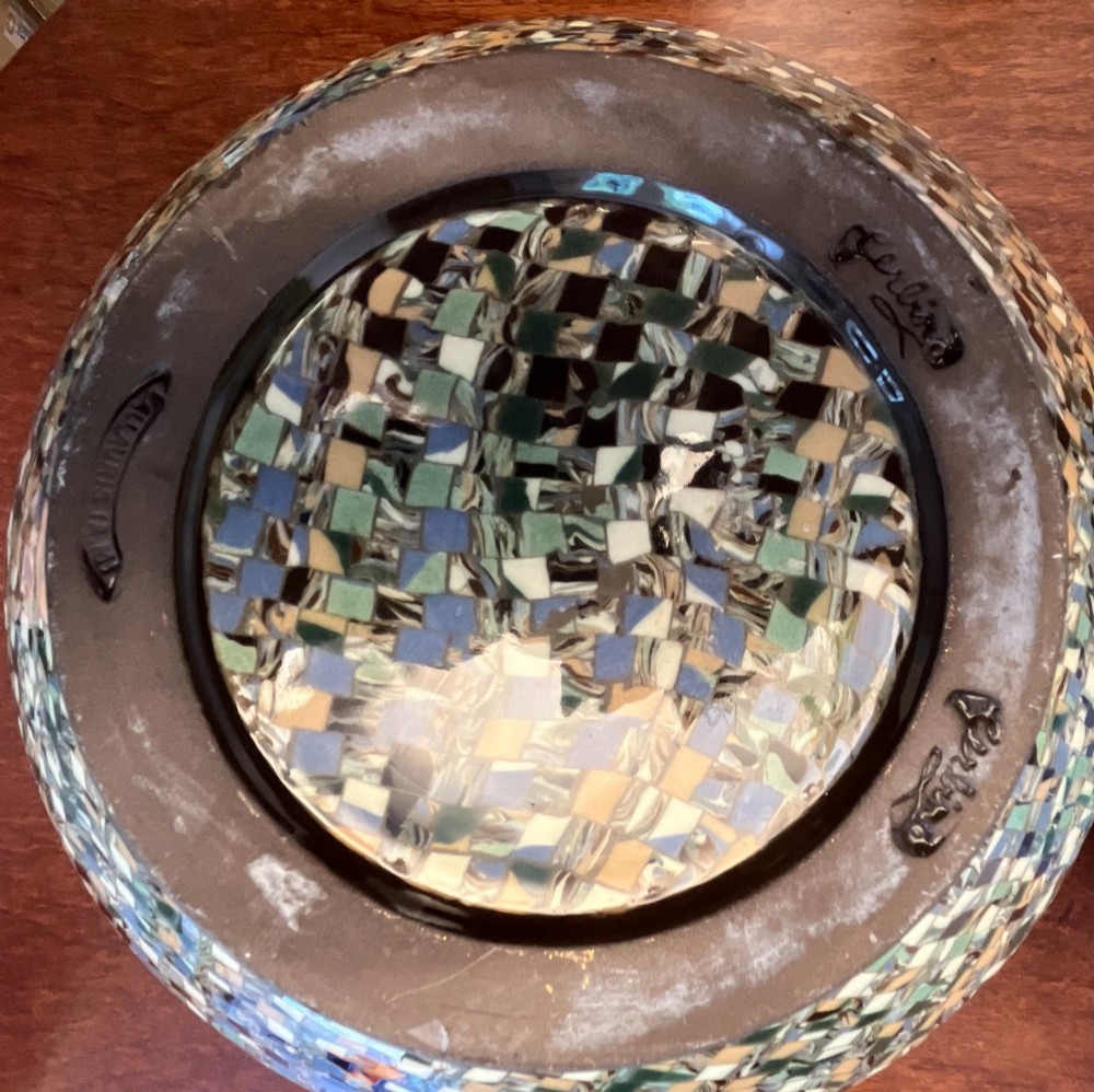 A pair of round ceramic vases with mosaic tile pattern bands around the rim and base and a blue and green stylised floral pattern across the centre. View IV