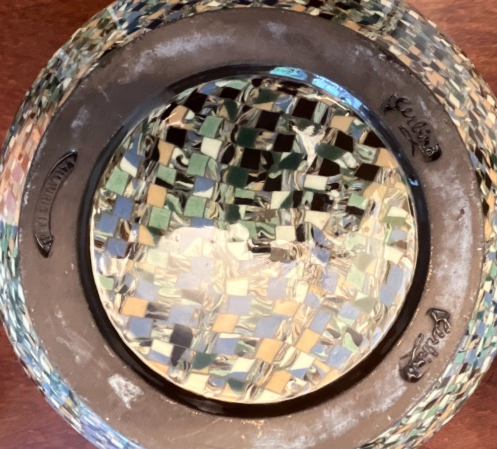 A pair of round ceramic vases with mosaic tile pattern bands around the rim and base and a blue and green stylised floral pattern across the centre. View V