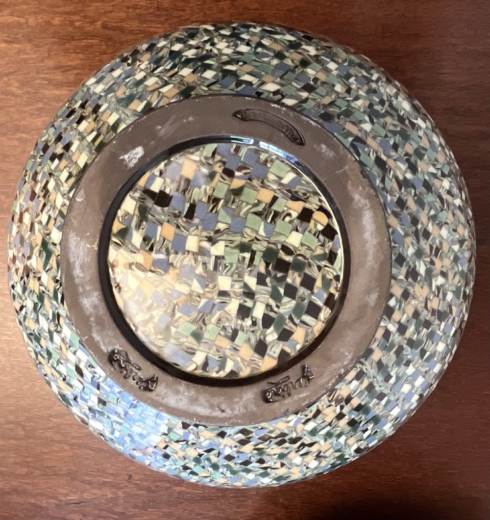 A pair of round ceramic vases with mosaic tile pattern bands around the rim and base and a blue and green stylised floral pattern across the centre. View VII
