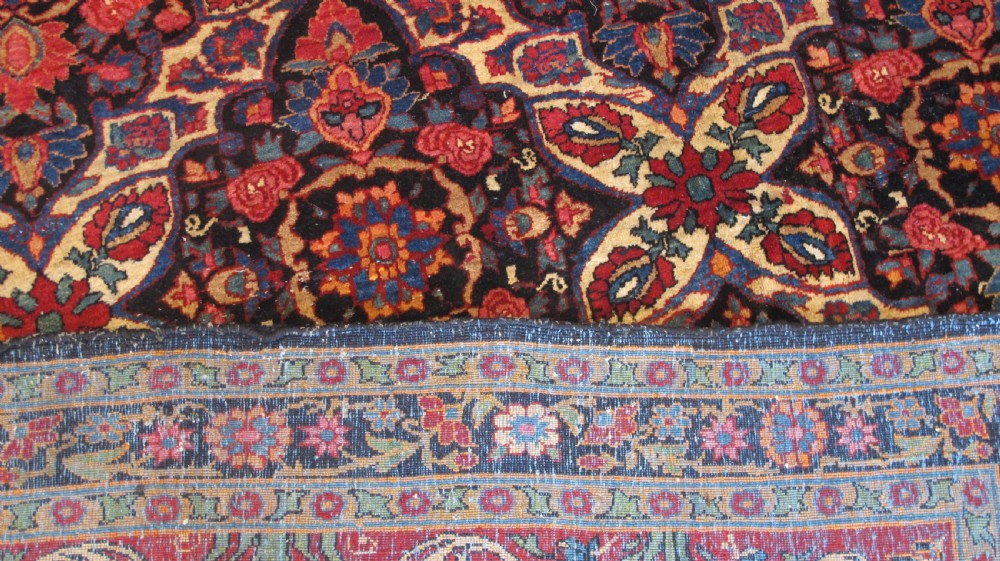 An extra-large hand-knotted Persian wool carpet featuring an intricate floral medallion lattice pattern in red, navy, and cream with an ornate multi-banded border. View IV