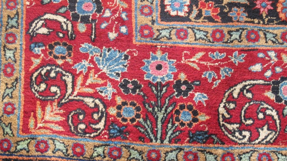 An extra-large hand-knotted Persian wool carpet featuring an intricate floral medallion lattice pattern in red, navy, and cream with an ornate multi-banded border. View VI