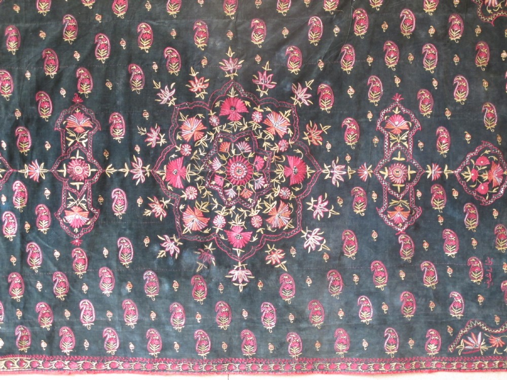 A large rectangular dark green velvet panel featuring intricate pink and gold embroidered floral medallions and boteh patterns. View II