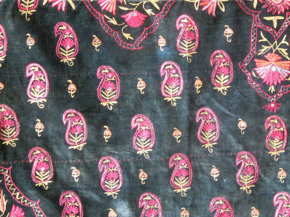 A large rectangular dark green velvet panel featuring intricate pink and gold embroidered floral medallions and boteh patterns. View IV
