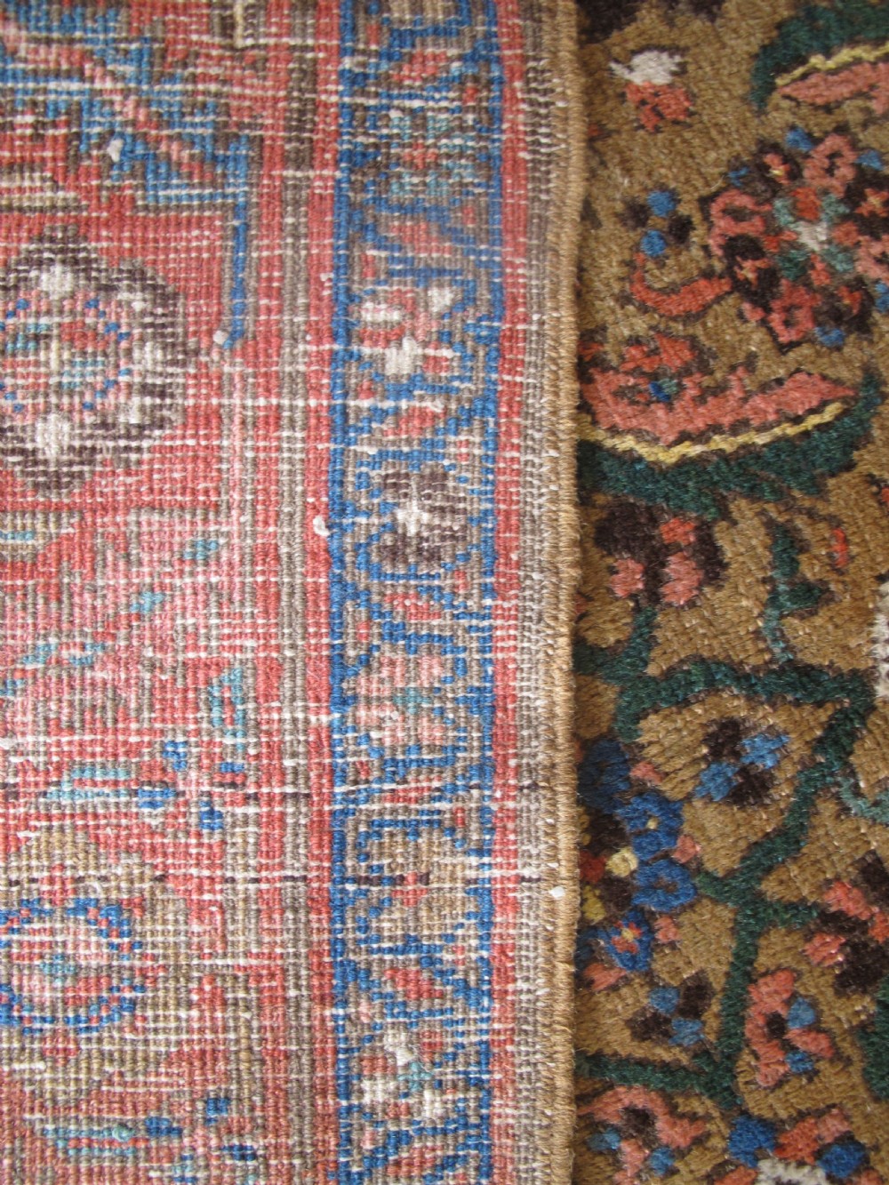 A long hand-knotted antique North-West Persian gallery carpet featuring detailed floral patterns on a camel field with terracotta borders. View IV