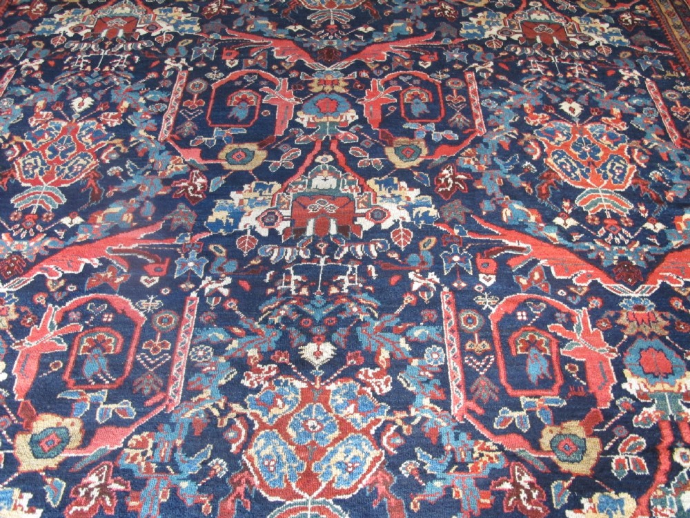 A large hand-knotted antique Persian Mahal carpet featuring a navy blue field filled with terracotta and light blue Mostafi floral patterns and a wide multi-band border. View III