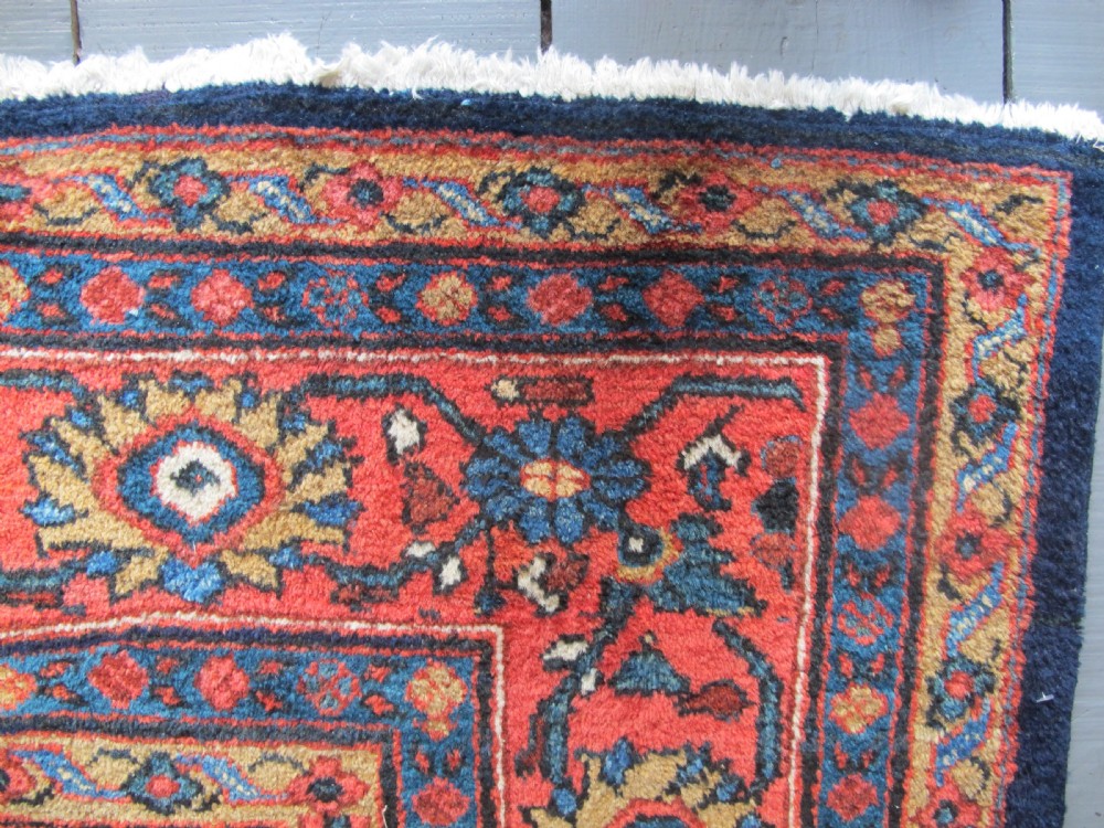 A large hand-knotted antique Persian Mahal carpet featuring a navy blue field filled with terracotta and light blue Mostafi floral patterns and a wide multi-band border. View IV