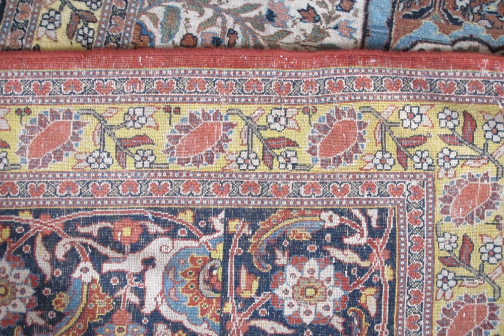 An oversized antique Haji Jalili Tabriz wool carpet featuring a central star-shaped medallion, intricate floral field, cream corner spandrels, and a multi-bordered pattern. View IV