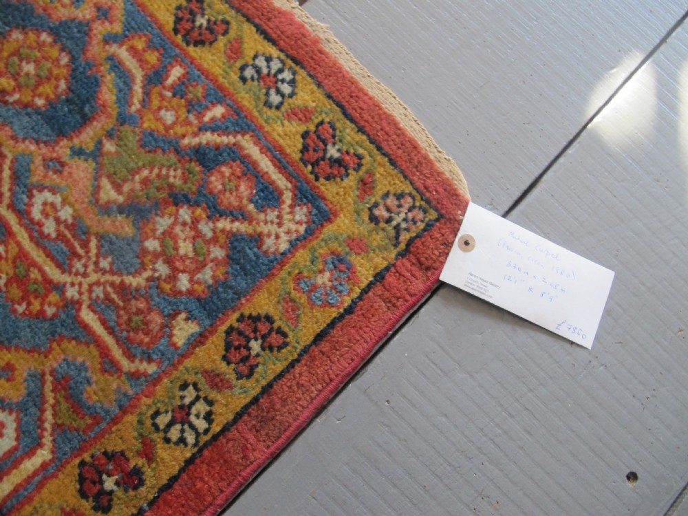 A large 19th-century antique Persian Mahal carpet featuring a terracotta red field with repeating floral lattice motifs and broad multi-tiered decorative borders. View VI