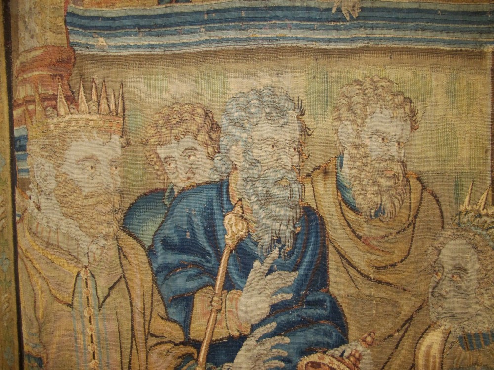 A large 16th-century Flemish Renaissance tapestry woven with figures in classical attire framed by an elaborate floral and fruit border. View IV