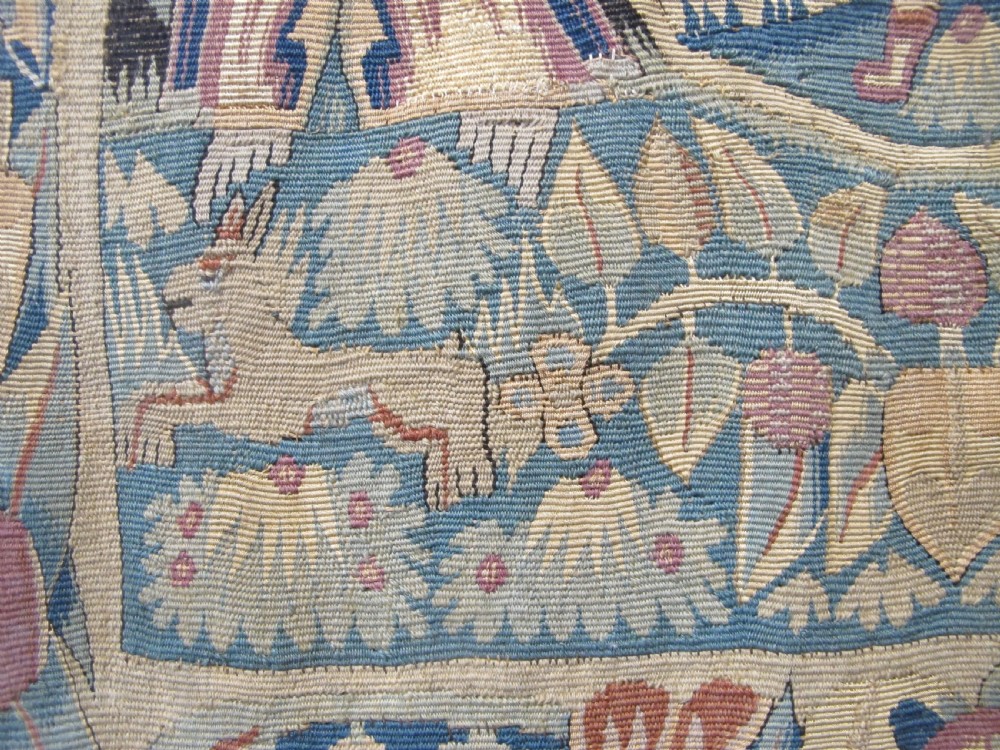 A pair of square 17th-century North German tapestry panels featuring allegorical figures and floral borders, presented in wooden frames. View VI