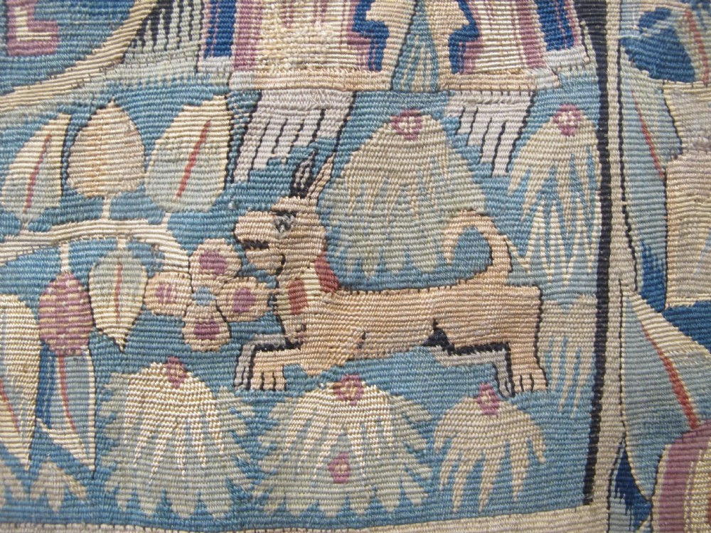 A pair of square 17th-century North German tapestry panels featuring allegorical figures and floral borders, presented in wooden frames. View VII