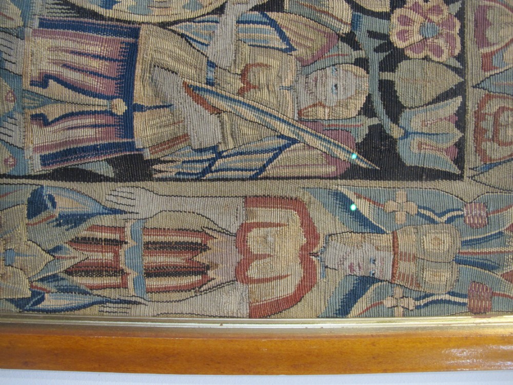 A pair of square 17th-century North German tapestry panels featuring allegorical figures and floral borders, presented in wooden frames. View VIII